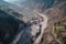 aerial view of massive landslide that has blocked a river, creating temporary lake