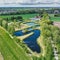 Aerial view of the meandering secondary clarifier at the end of a village sewage treatment plant in Germany
