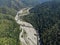 Aerial view meanders of river. Flying over the beautiful river and mountain, sunny day. Aerial drone shot, landscape