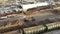 Aerial view of Mechanical gripper loading lumber on to truck for transportation. Forest cutting concept. A logging train