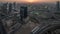 Aerial view of media city and al barsha heights district area night to day timelapse from Dubai marina.