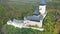 Aerial view of medieval Karlstejn castle in autumn park, Czech Republic