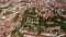 Aerial view medieval stone Saint George Castle on hill above town. Drone camera flying around castle hill. Lisbon