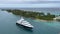 An aerial view of a Mega Yacht cruising into the harbor in Nassau, Bahamas