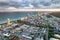 Aerial view of Miami Beach at sunset from helicopter. City skyline and water. Cloudy skies, a vacation dream