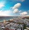 Aerial view of Miami Beach at sunset from helicopter. City skyline and water. Cloudy skies, a vacation dream