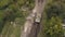 Aerial view military soldiers sittingon moving army tank on shooting training