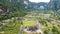 Aerial view of Minangkabau house or Rumah Gadang in a beautiful landscape view of Harau Valley with mountains valley and grass