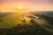 Aerial View Of Misty Autumn Field And Forest Landscape. Top View Of Empty Clean Field In Sunny Sunrise Morning. Drone