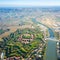 Aerial view of modern six-star hexagon shaped fort Cittadella of Alessandria on winding river Tanaro. Piedmont, Italy.