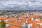 Aerial view on Mondego river and banks with Coimbra city, sky with clouds as background, in Portugal