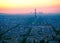 Aerial view, from Montparnasse tower at sunset, view of the Eiffel Tower and La Defense district in Paris, France.