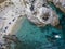 Aerial view of moored boats floating on a transparent sea. Scuba diving and summer holidays. Capo Vaticano, Calabria, Italy