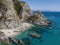 Aerial view of moored boats floating on a transparent sea. Scuba diving and summer holidays. Capo Vaticano, Calabria, Italy