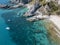 Aerial view of moored boats floating on a transparent sea. Scuba diving and summer holidays. Capo Vaticano, Calabria, Italy