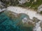 Aerial view of moored boats floating on a transparent sea. Scuba diving and summer holidays. Capo Vaticano, Calabria, Italy