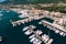 Aerial view of moored yachts near the modern buildings of the Porto resort. Montenegro