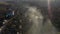 Aerial view of morning mist above a village. House roofs raising from clouds