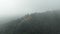 Aerial view at morning mist Wat Phra That Doi Phra Chan. and Daibutsu Buddha on the greenery mountain in the rainforest north of