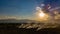 Aerial view. The morning sunrises with dry grass is burning on the field.