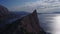 Aerial View: morning view of the sea through the rocks in the Crimea. Beautiful view of Blue bay from cape Kapchik in 4K