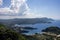 Aerial View of the Most Beautiful Bay in Corfu Greece. Landmark of Famous Mediterranean Island under a Cloudy Blue Sky