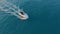 Aerial view. Motor boat sailing in blue sea. Luxury yacht racing deep water. Travel holiday on white yacht.