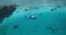 Aerial view of motorboat approaching hydroplane floating in turquoise water