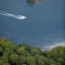 Aerial View : motorboat waterskiing on a lake