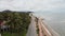 Aerial view of motorcycle driving along coastline in Huahin, Thailand.