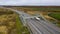 Aerial view of motorway intersections, of speeding cars and trucks