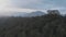 Aerial view of mount Batur in the evening with the evaporation of clouds.