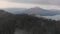 Aerial view of mount Batur and lake Batur in the evening with the evaporation of clouds.