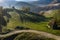 Aerial view of a mountain homestead in the autumn in early morning lights