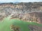 Aerial view on mountain lake. Drone view water reservoir at mountain valley. Beautiful view from above on smooth blue surface of