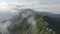 Aerial view mountain ridge panorama flight through the clouds at sunrise