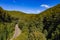 Aerial view of a mountain road through a healthy mixed forest in Germany