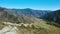 Aerial View Mountain Road in a Sunny Day.