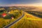 Aerial view of mountain road in village at sunset in autumn