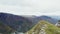 Aerial view of a mountain rocky peak overlooking the valley