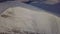 Aerial view of mountain snow-capped peak, at sunrise