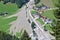 Aerial view of mountain stream in the Austrian Alps blocked after a massive mudflow with excavator and truck working to clean up