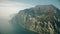 Aerial view of mountainous shore of the Lake Garda on a hazy day, Italy