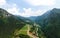 Aerial view of mountains Dietrobeseno and Sant Andrea northern vineyards, vine fields production and industry in Besenello, Trento