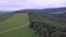 Aerial view of mountains with green field and road in the Slovak Tatras