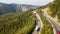 Aerial view of the movement of vehicles on a serpentine mountain road. Croatia