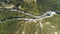 Aerial view of the movement of vehicles on a serpentine mountain road. Croatia