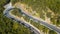 Aerial view of the movement of vehicles on a serpentine mountain road. Croatia