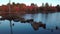 Aerial view moving over the lake and the beaver dam