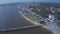 Aerial view moving toward Southport Pier in NC.